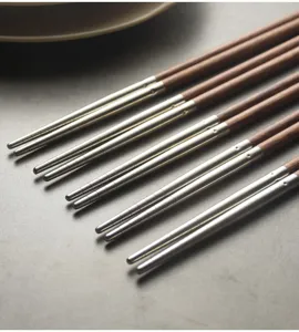 Close-up of 304 stainless steel and wood chopsticks showing anti-slip texture.