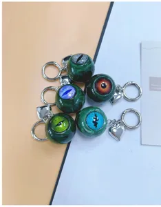 Close-up of vibrant resin eyeball keychains showing intricate iris details and charms