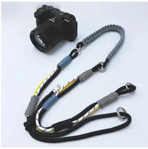 Detailed view of handcrafted braided adjustable multi-use camera strap with metal rings