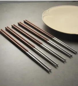 Close-up detail showing the elegant wood grain and 304 stainless steel tips of these chopsticks.