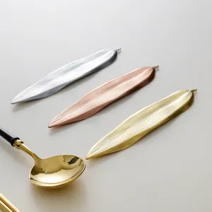 Set of creative Japanese leaf-shaped metal chopstick rests in silver, rose gold, and gold