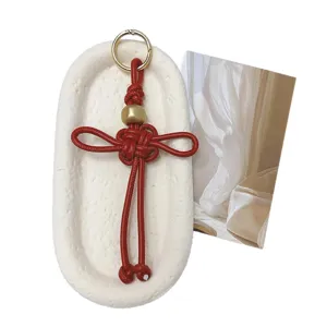 Porte-clés nœud chinois rouge fait main en cuir PU avec perle dorée et anneau d'or