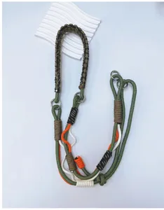 Detailed view of hand-woven colorful paracord lanyard with metal hardware clips