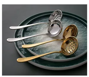 Detail view of 304 stainless steel soup ladles and slotted spoons in gold and silver finish
