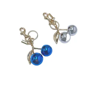 Cute metallic cherry keychains in blue and silver, perfect as stylish bag charms or gifts.