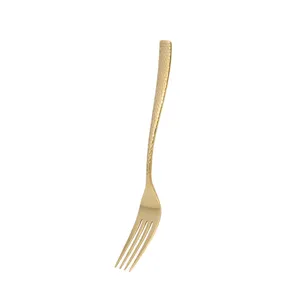 Premium golden stainless steel dinner fork with elegant hammered handle texture finish