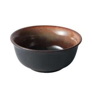 Retro Japanese style ceramic bowl with kiln glazed interior and matte black finish