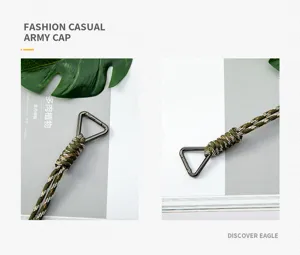 Close-up of hand-woven camouflage paracord lanyard with black triangular carabiner