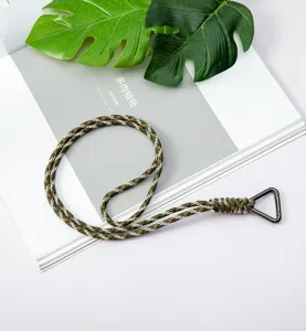 Durable camo paracord lanyard with triangle carabiner shown on magazine backdrop