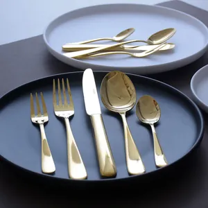 Luxury gold stainless steel cutlery set with steak knife, forks, and spoons