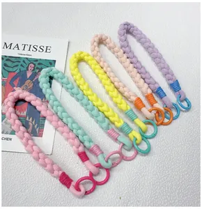 Detailed view of handmade colorful braided phone wrist straps with circular hooks