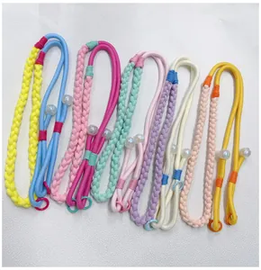 Collection of various colorful hand-woven phone lanyards featuring decorative bead accents