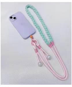 Detailed view of handcrafted braided phone lanyard in mint and pink dopamine colors