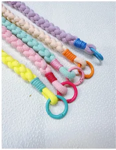 Detailed view of colorful handmade braided phone wrist straps with spring o-rings.
