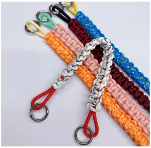 Detail view of multicolored hand-woven paracord lanyards for mobile phones and bags