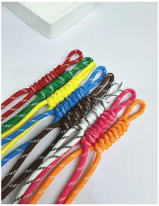 Close-up detail of handmade multi-colored woven paracord lanyards for bags and keys