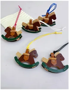 Handmade leather rocking horse bag charms in various colors for cute accessories