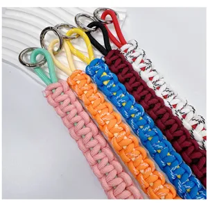 Detailed view of colorful handmade braided paracord lanyards with silver metal O-rings