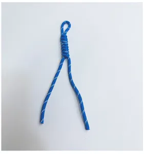 Detail showing texture of hand-woven blue braided lanyard cord with white dots