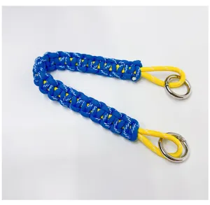 Close-up detail of blue and yellow hand-woven paracord wrist strap with metal rings