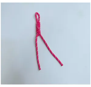 Handmade pink braided rope lanyard detail with white reflective patterns for phone or bag