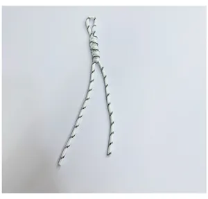 Close-up of handmade woven white and black striped lanyard with intricate knot detail