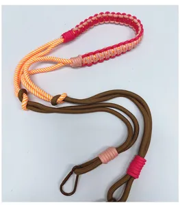 Close-up detail of the colorful hand-woven paracord strap with durable metal carabiner