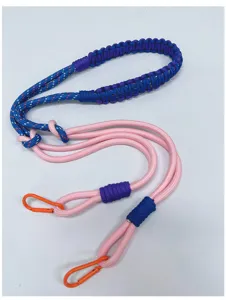 Hand-woven crossbody strap detail with sturdy orange carabiners and colorful ropes