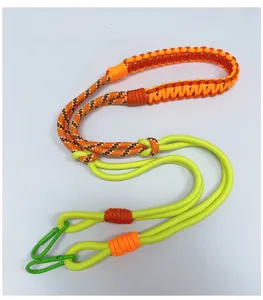 Detail showing multi-colored handmade woven paracord shoulder strap with carabiners