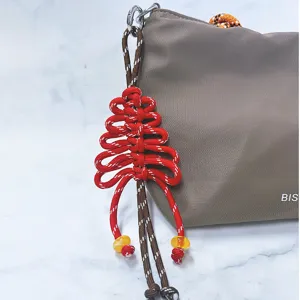Ciondolo per borsa ad albero di Natale in paracord rosso fatto a mano con perle gialle