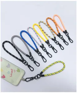Macro view of colorful woven wrist lanyards with durable black metal lobster clasps