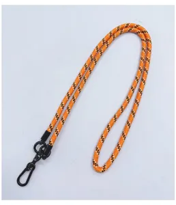Detail view of durable orange woven crossbody phone lanyard with metal clip