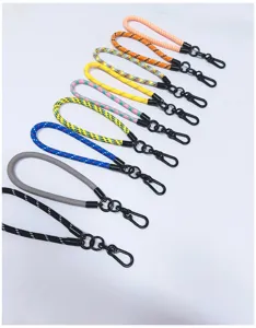 Detailed view of colorful braided phone wrist lanyards with metal clips