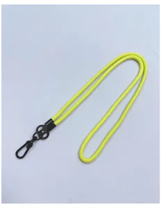 Detail view of neon yellow thick nylon crossbody lanyard with black metal hook