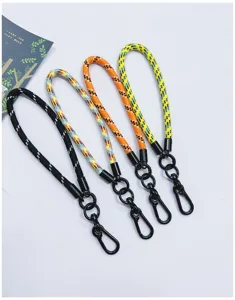 Detailed view of four colorful braided wrist lanyards with black metal lobster clasps