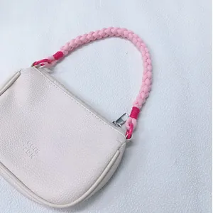 Handmade pink braided wrist strap lanyard with cream pebbled leather zip pouch bag.