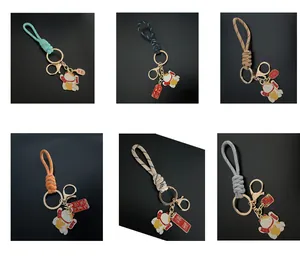 Set of six colorful hand-woven wrist strap keychains with lucky cat charms for bags