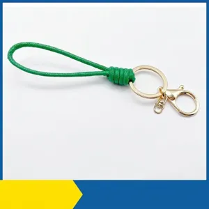 Hand-braided green waxed cord keychain with golden lobster clasp for car keys accessories
