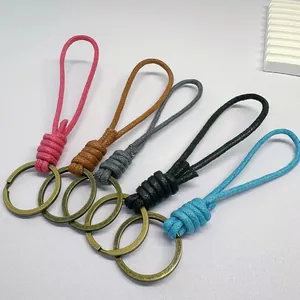 Set of five handmade woven wax rope keychains in various colors for car keys and bags