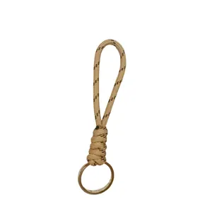 Hand-woven paracord lanyard keychain for car keys in beige featuring a metal ring
