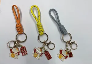Hand-woven paracord wrist strap keychain set with Maneki-neko and lucky charms