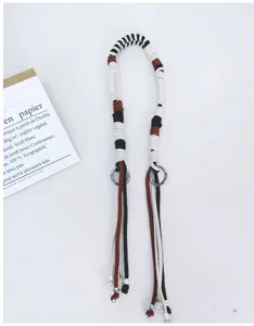 Detailed view of handmade woven cotton rope bag strap with beads and silver rings