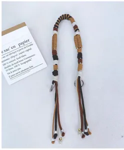 Detail view of a multi-colored handmade cotton rope woven strap for versatile bag use