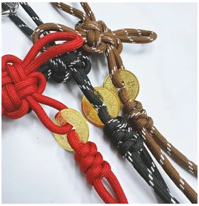Detail showing multi-color handmade braided Chinese knot charms with gold coins