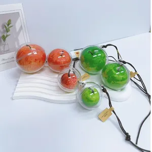 Close-up of simulation apple ornaments in transparent shells for Christmas decoration