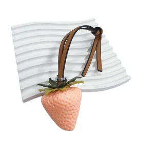 Realistic strawberry bag charm featuring a stylish leather strap for cute lady handbags.