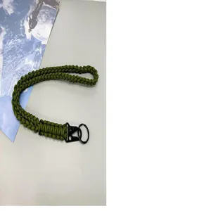 Detail view of durable olive green braided paracord lanyard with sturdy black metal clip