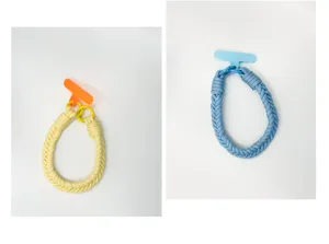 Detailed view of handmade braided phone wrist straps in bright yellow and blue variants.