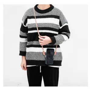 Hand-braided universal crossbody phone lanyard strap shown worn over a striped sweater