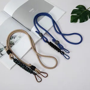 Durable and stylish paracord phone lanyard with metal carabiners for crossbody use.